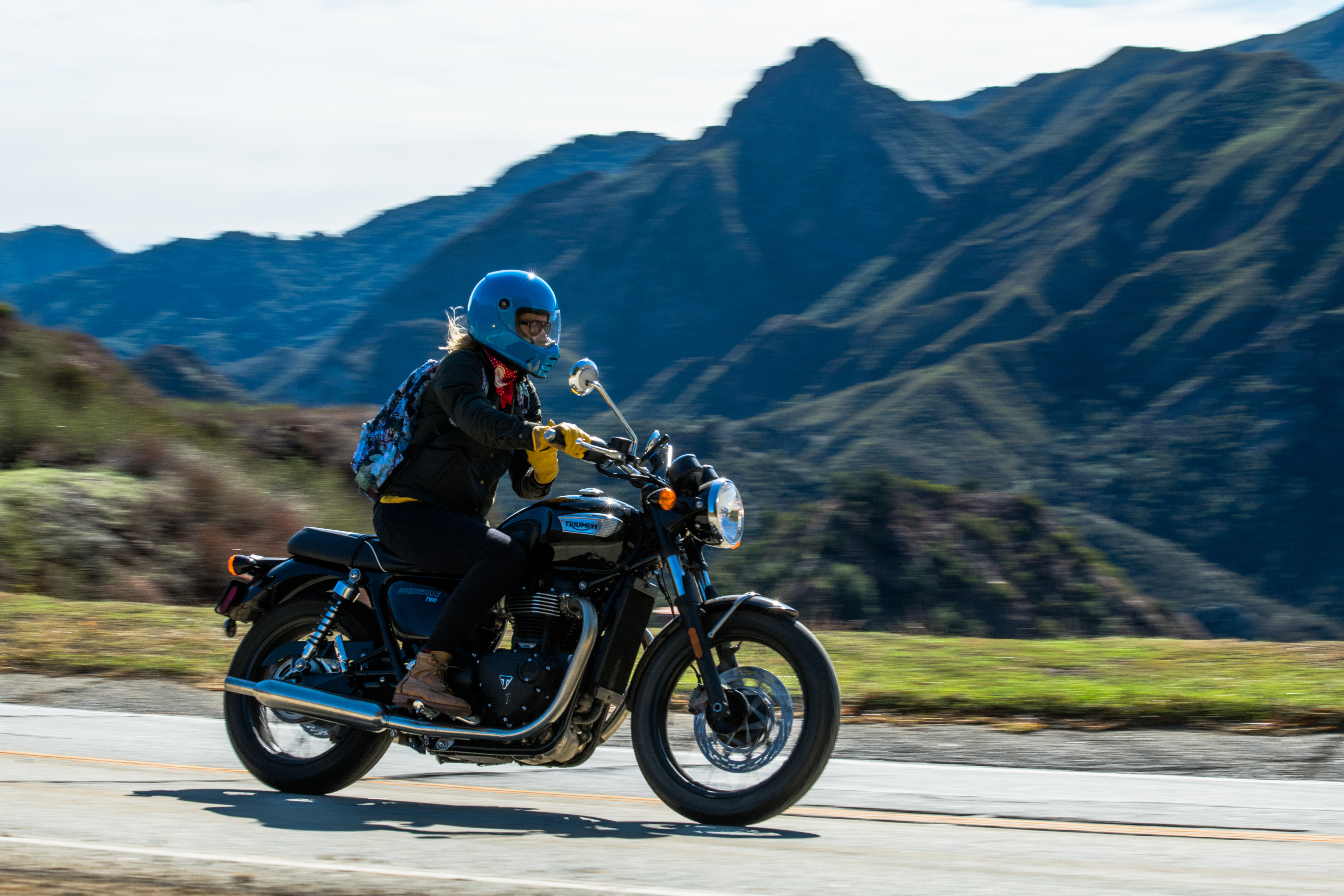 Ashley Wandishin riding the Triumph Street Scrambler through the mountains